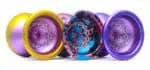 Vibrant YoYoFactory yoyos in yellow, pink, blue, and purple for professional and beginner players.