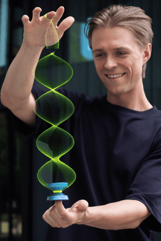 YoYoFactory Europe, showcasing a professional performing a complex yoyo trick with a glowing green y.