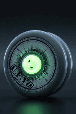 Close-up of a high-tech yo-yo with glowing green center and sleek design.